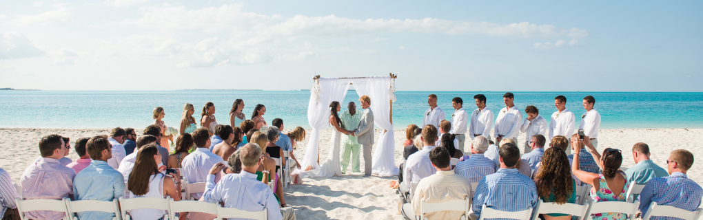 For a us-based couple interested in a destination wedding, why should they focus on all-inclusive resorts in Mexico, the Caribbean, Central America and beyond, and why should they use a travel agent for this 