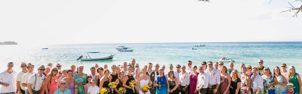 For a us-based couple interested in a destination wedding, why should they focus on all-inclusive resorts in Mexico, the Caribbean, Central America and beyond, and why should they use a travel agent for this 