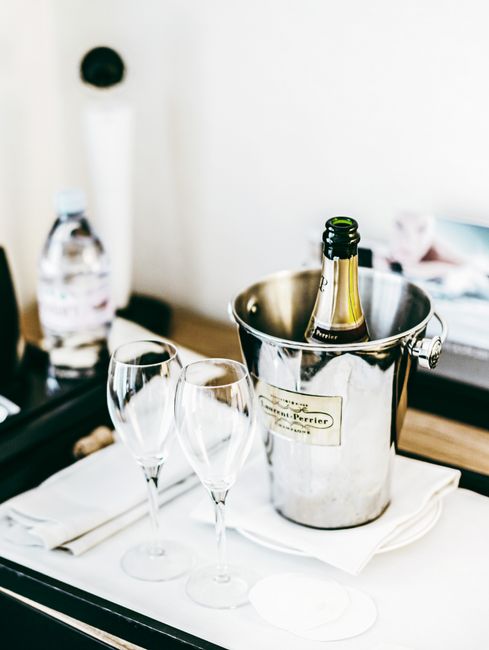 Luxury suite champagne welcome amenity showcasing travel advisor exclusive VIP consortium perks