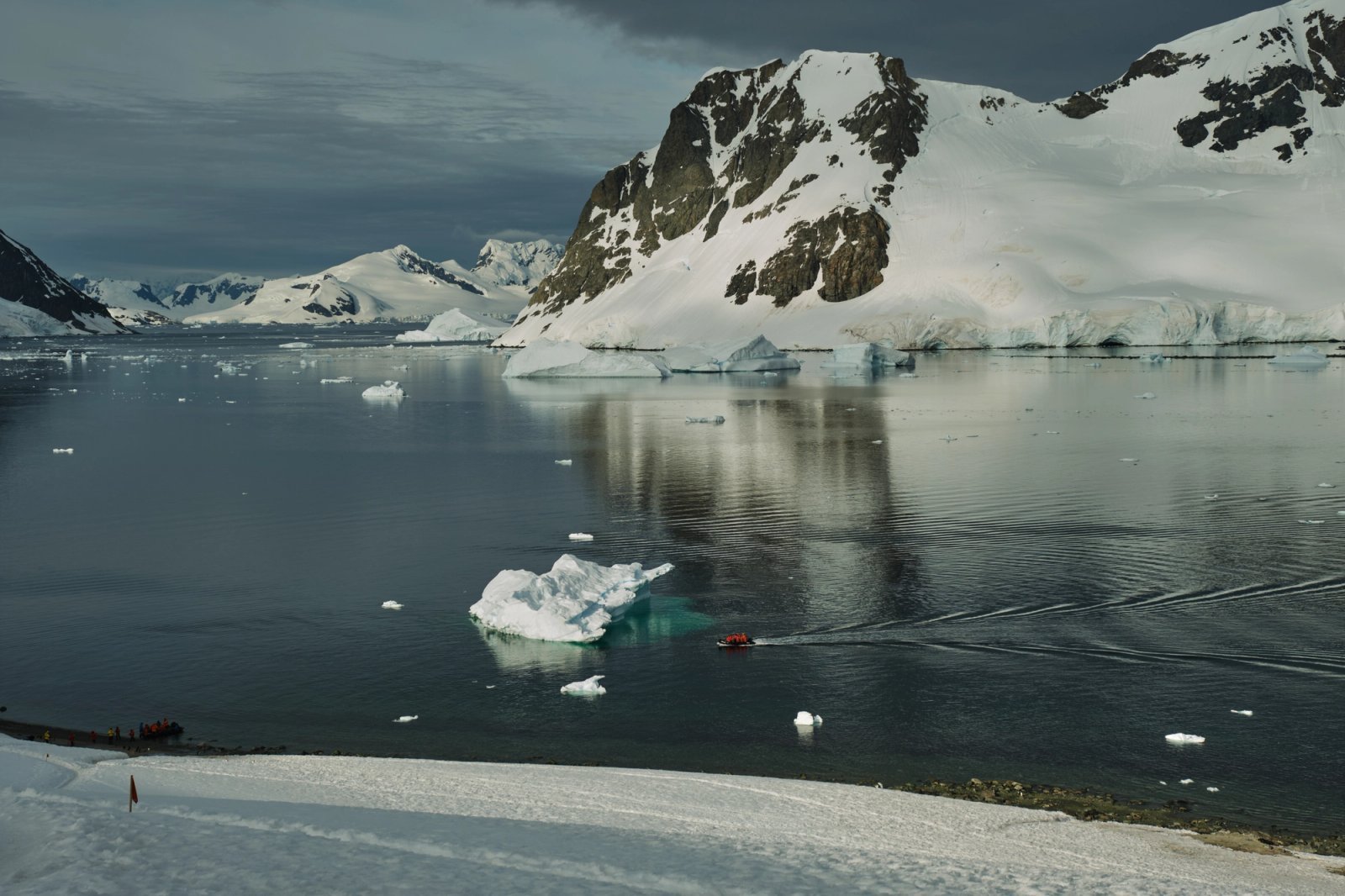 Abercrombie & Kent luxury expedition cruise navigating crystalline icebergs in Antarctica