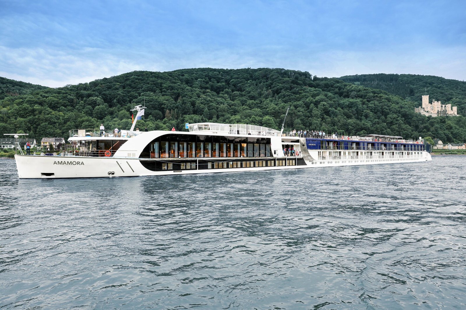 AmaWaterways award-winning river ship AmaMora cruising past historic castles on the Rhine River