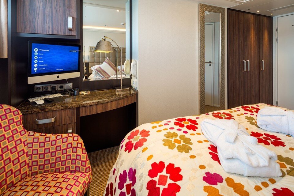 AmaWaterways Category CA French Balcony stateroom interior with floor-to-ceiling glass sliding doors