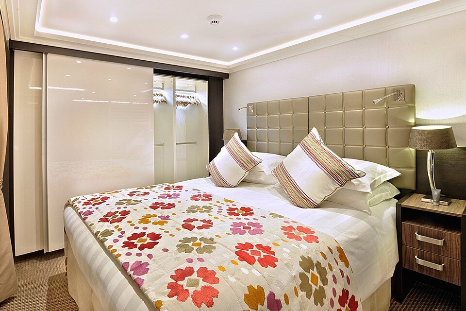 AmaWaterways luxury Suite with expansive sitting room, two balconies, and spacious marble bathroom