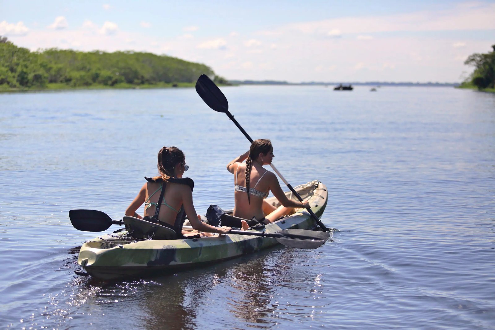 Guests kayaking along calm Amazonian tributaries during an Aqua Expeditions voyage