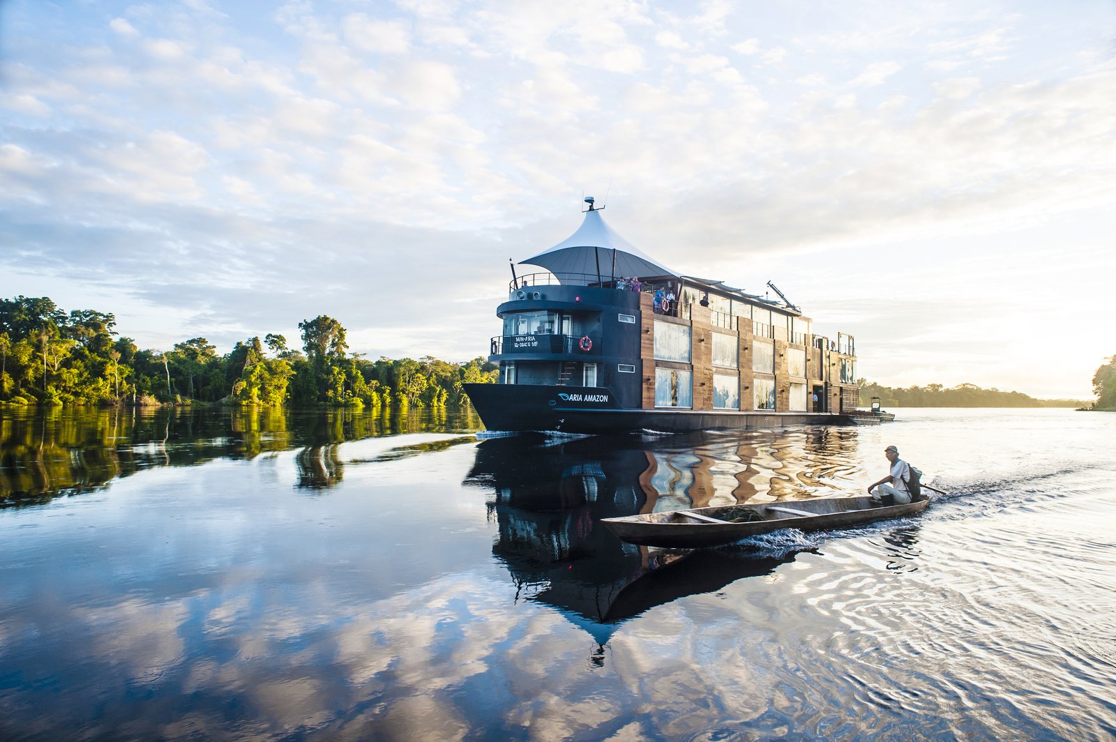 Aria Amazon luxury expedition vessel with matte-black hull and floor-to-ceiling glass panoramic windows