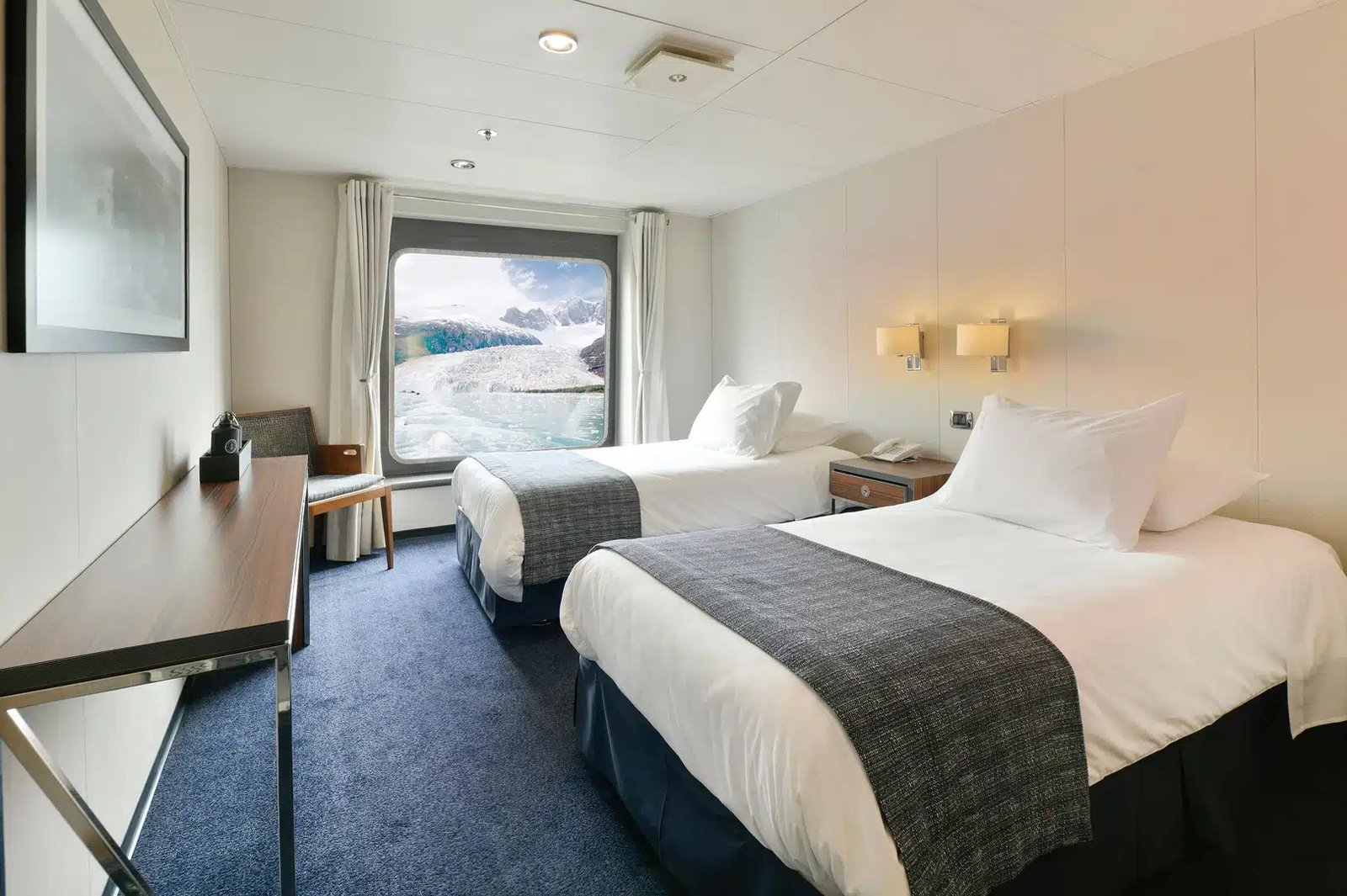 AA Standard Twin cabin with wide picture window and twin beds on Australis Cruises