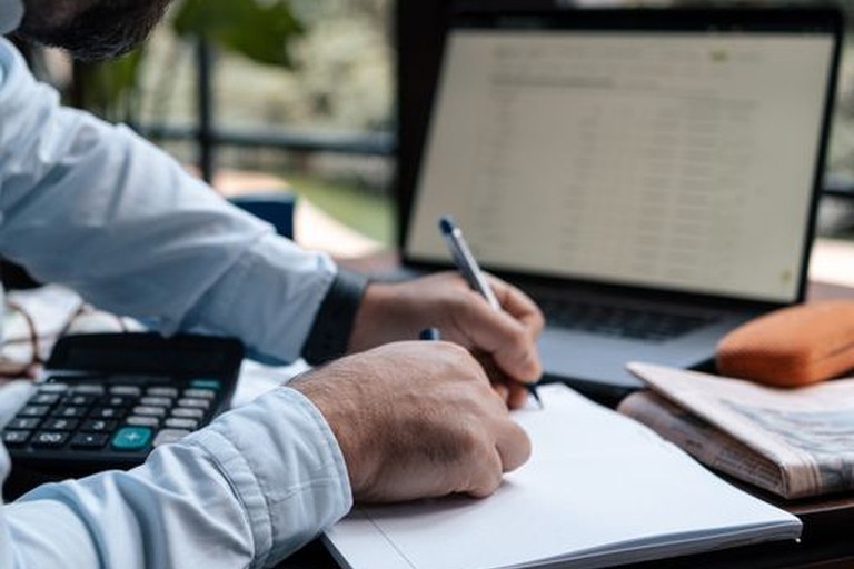 Travel advisor analyzing group travel commission overrides and Tour Conductor revenue compared to individual FIT bookings