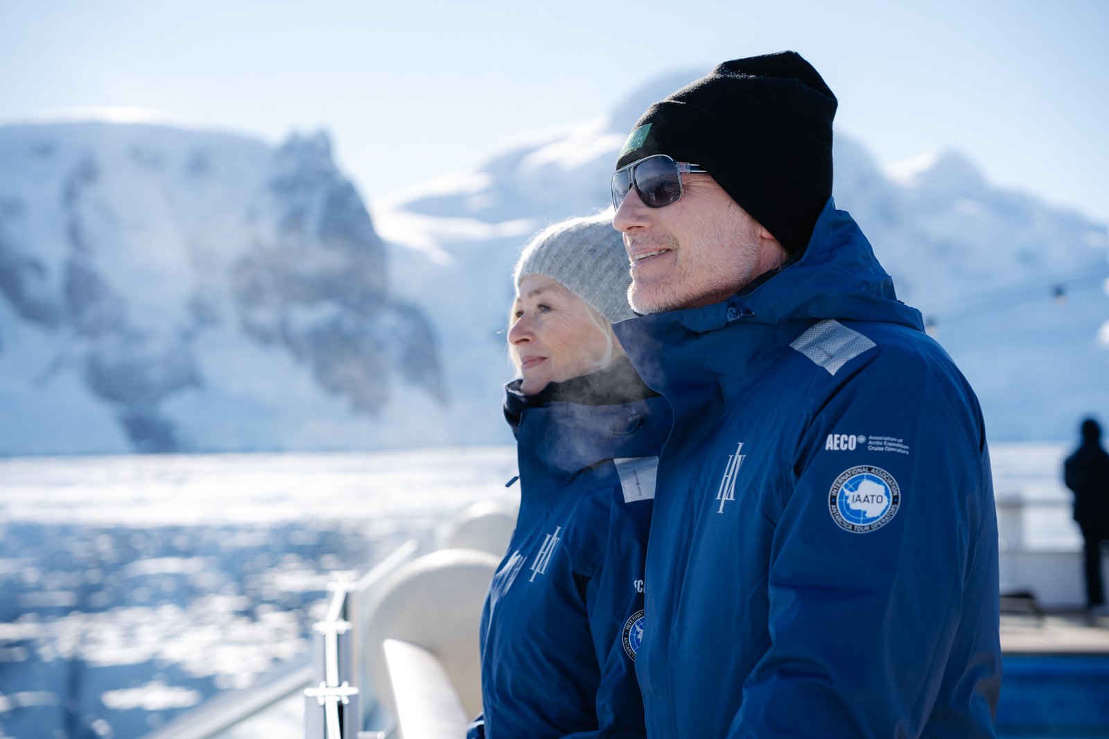 Expedition travelers viewing wildlife from the open observation deck of HX ship
