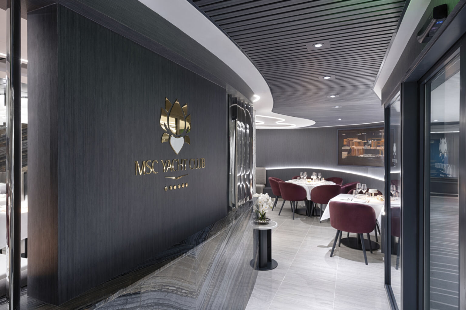 MSC Yacht Club deluxe suite with plush Egyptian cotton linens and private balcony