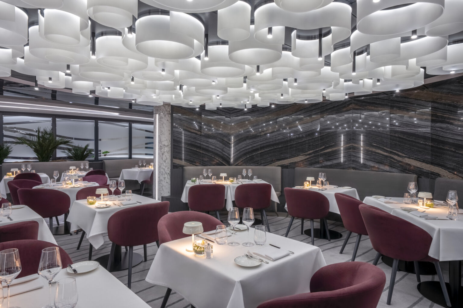 MSC Yacht Club private restaurant featuring complimentary fine dining and sommelier service