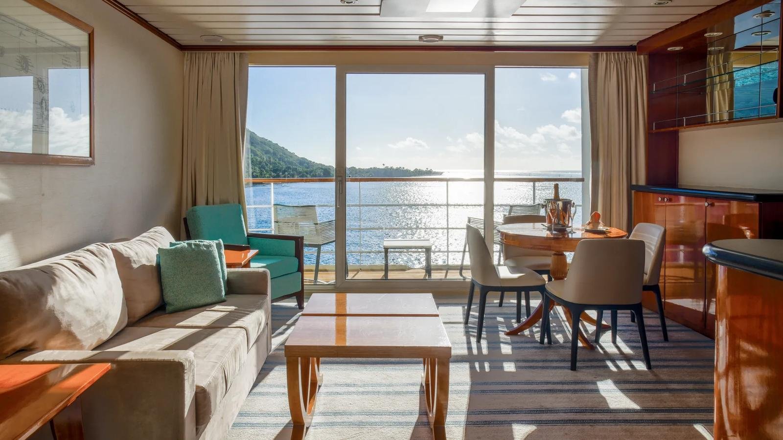 Owner's Suite living salon and master bedroom aboard the m/s Paul Gauguin
