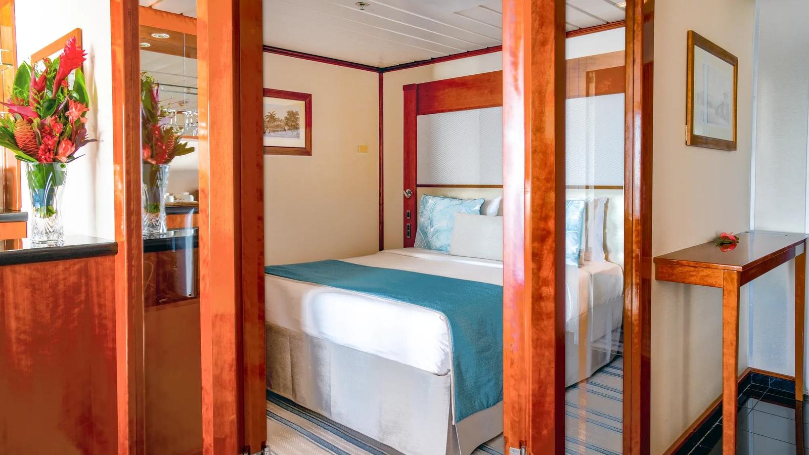 Teak veranda balcony of the Owner's Suite overlooking French Polynesia waters