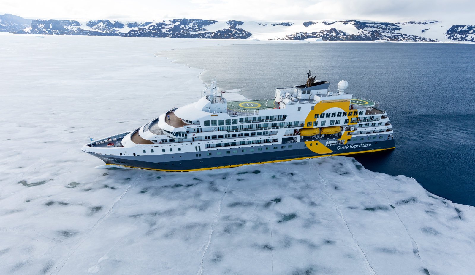 Quark Expeditions Ultramarine cruising through Antarctic icebergs