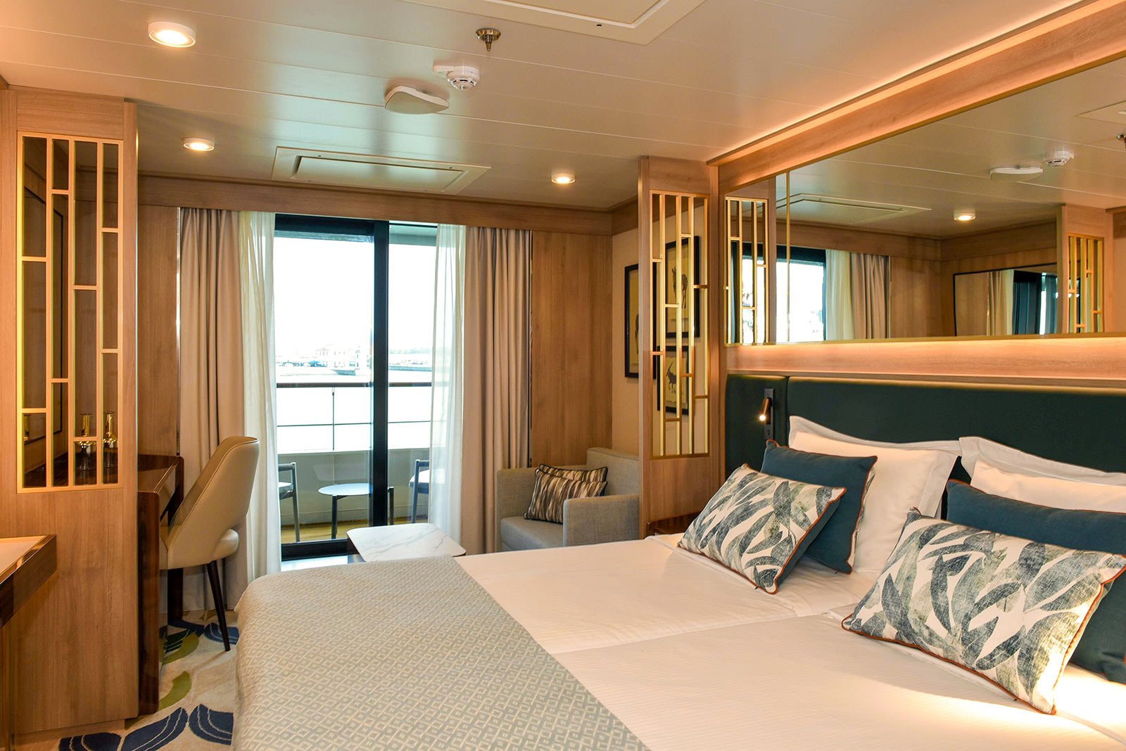 World Explorer Veranda Suite bedroom opening to private step-out balcony