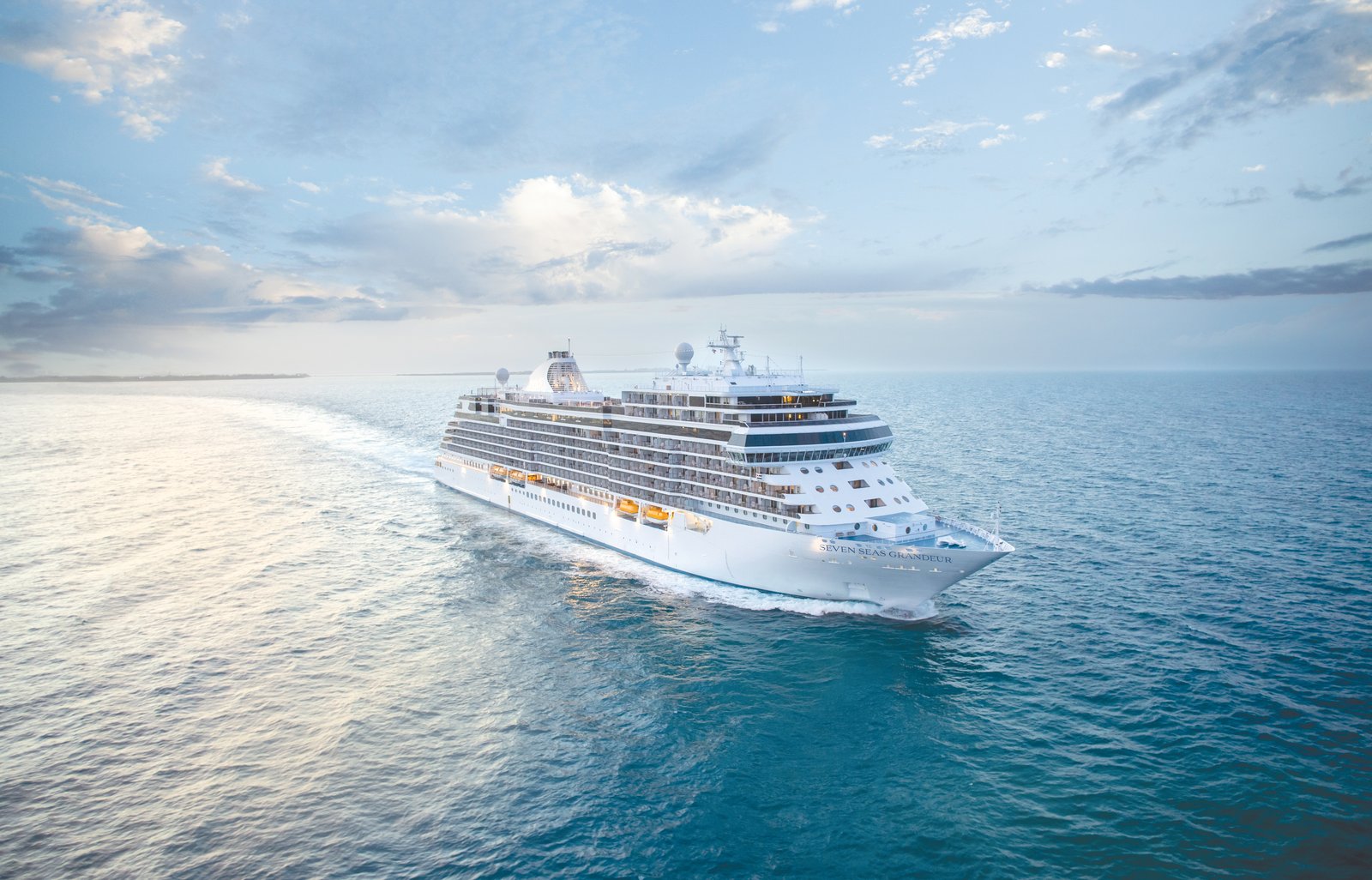 Seven Seas Grandeur ultra-luxury cruise ship sailing on open ocean