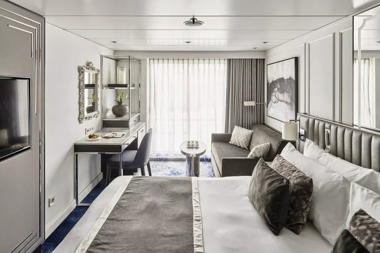 Penthouse Suite king bedroom overlooking the Danube River through a French balcony