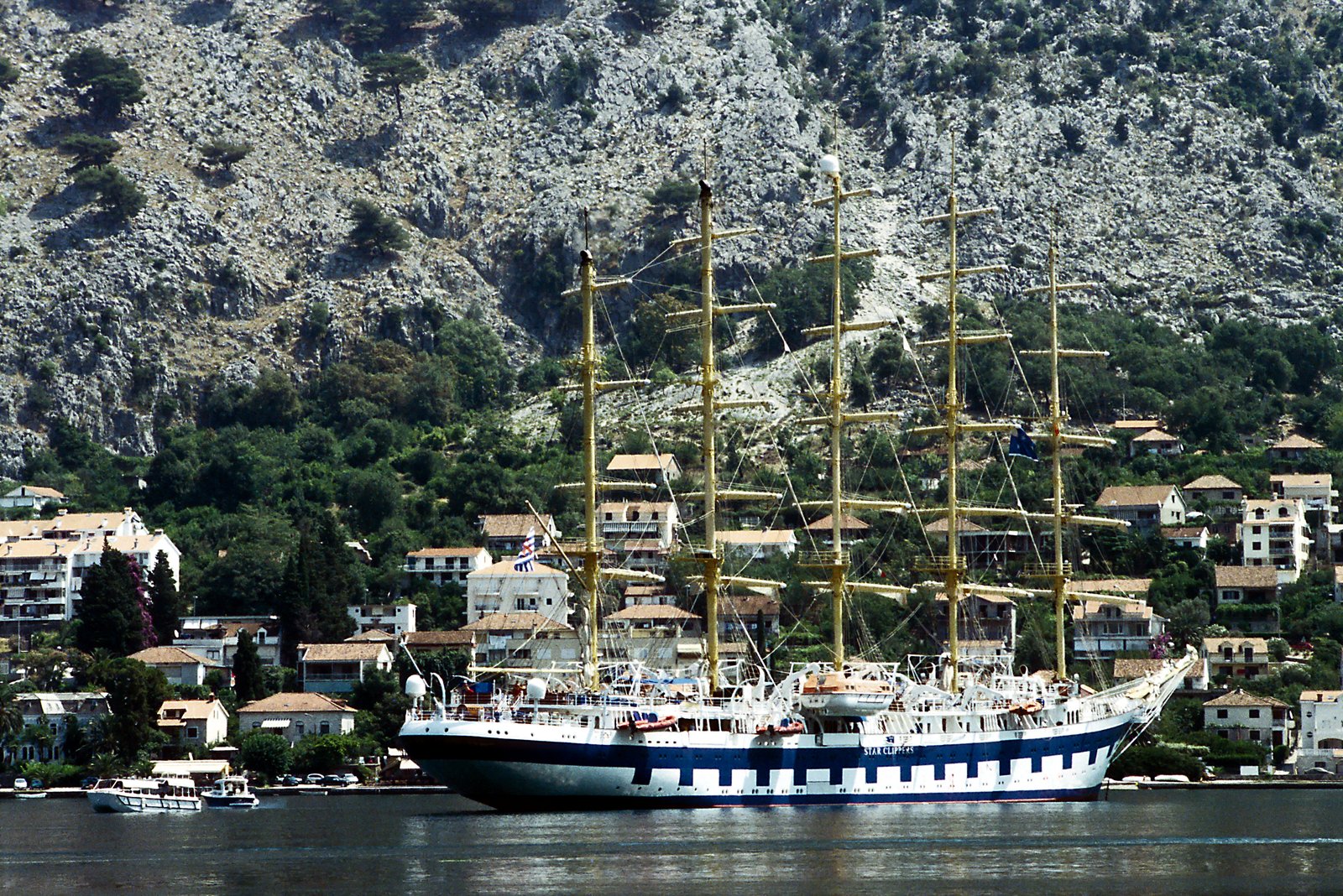 Royal Clipper anchored in Kotor Bay fjord surrounded by dramatic coastal mountains