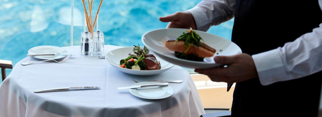 Gourmet course-by-course in-suite dining service aboard Seabourn