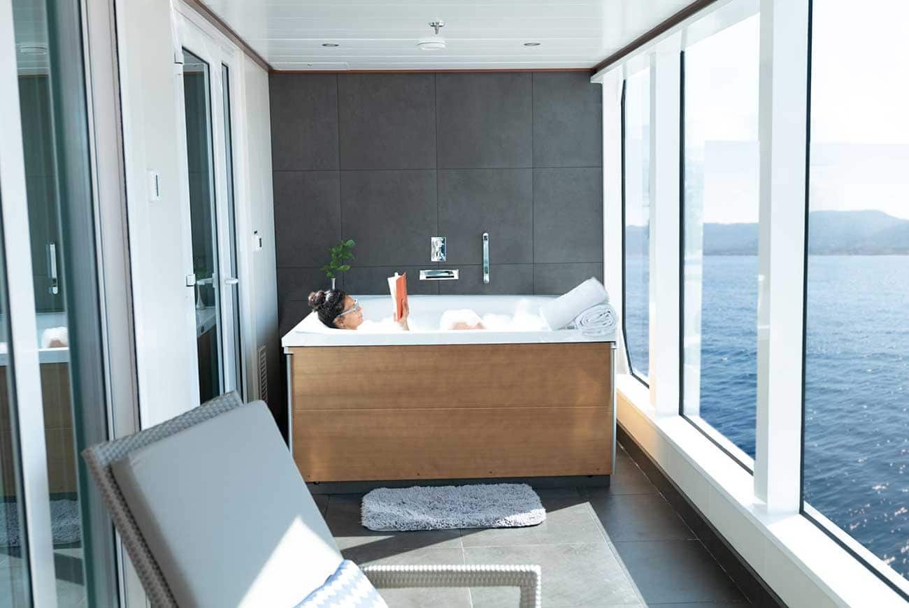 Five-piece marble bathroom with whirlpool soaking tub aboard Seabourn