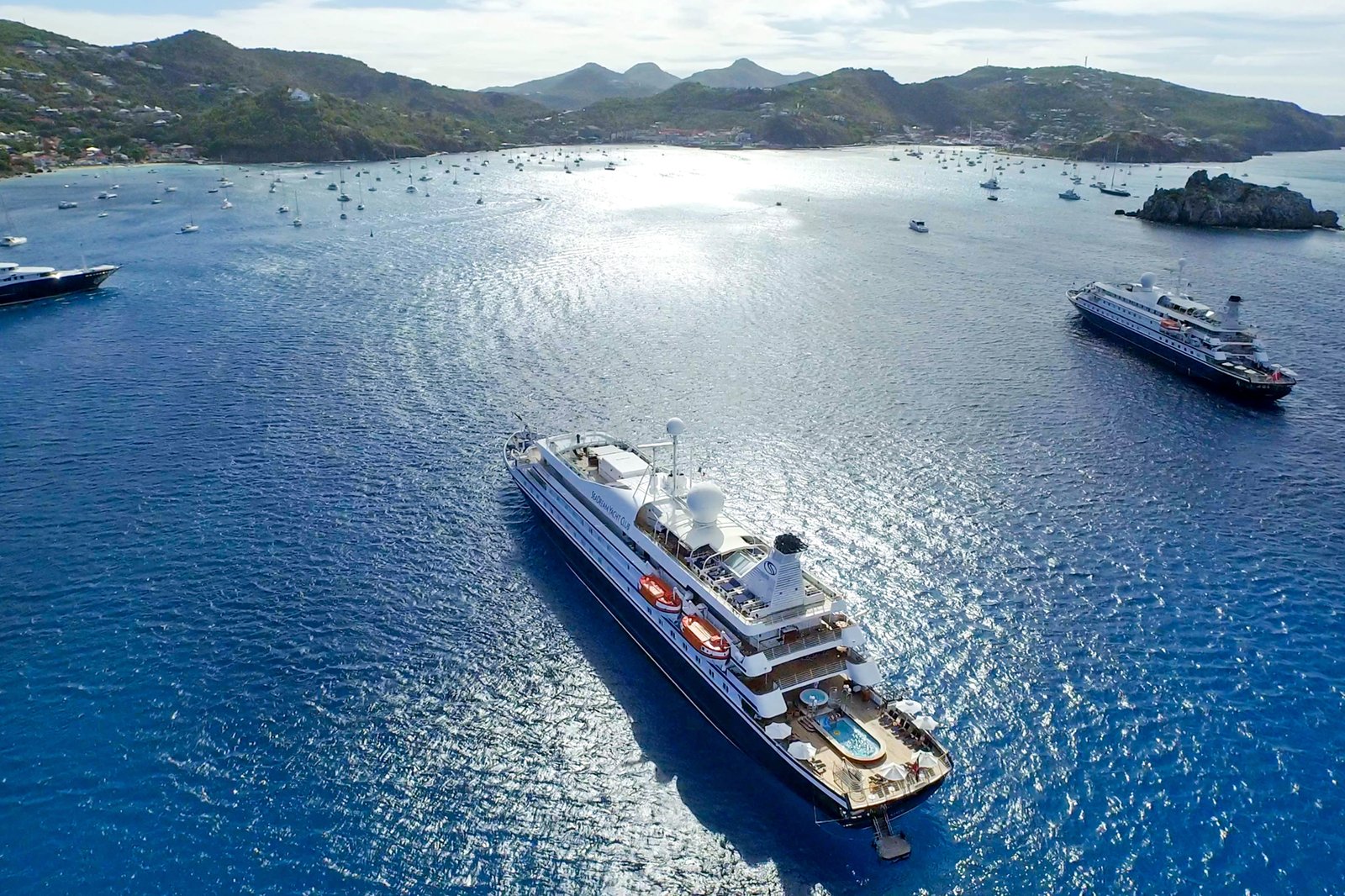 Twin ultra-luxury boutique mega yachts SeaDream I and SeaDream II sailing in tandem