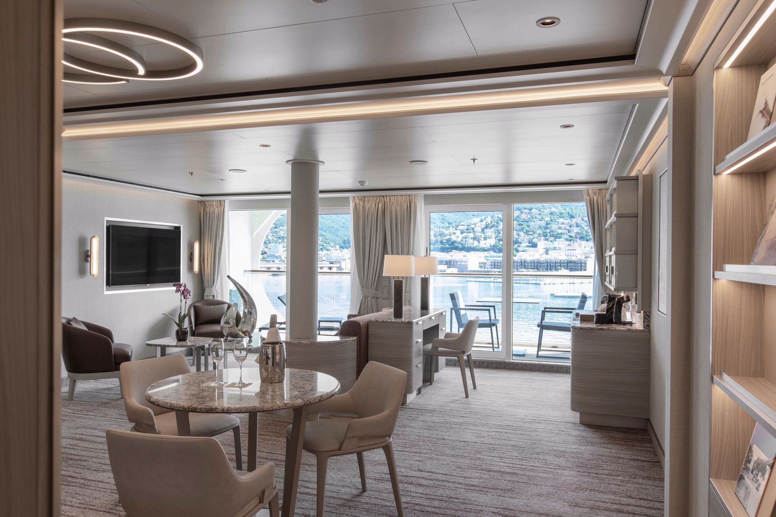 Silversea white-gloved butler serving private multi-course gourmet in-suite dinner
