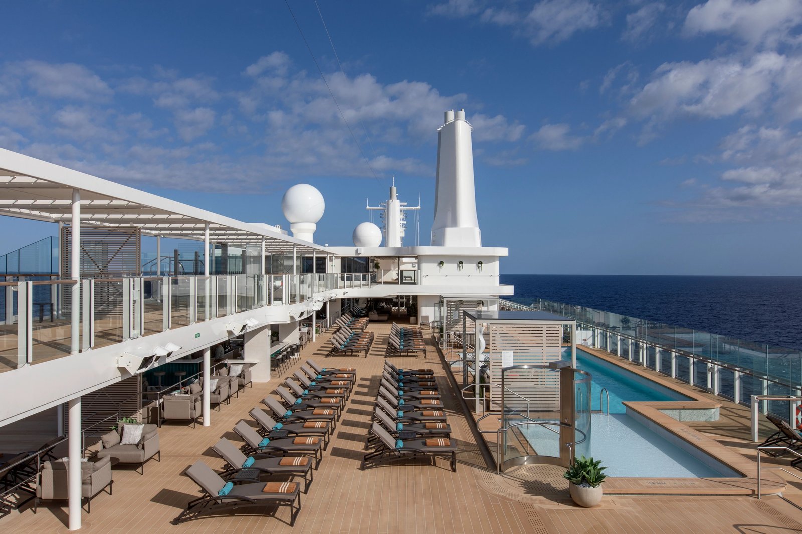 Silver Nova's revolutionary asymmetrical oceanview pool deck overlooking scenic coastal harbors