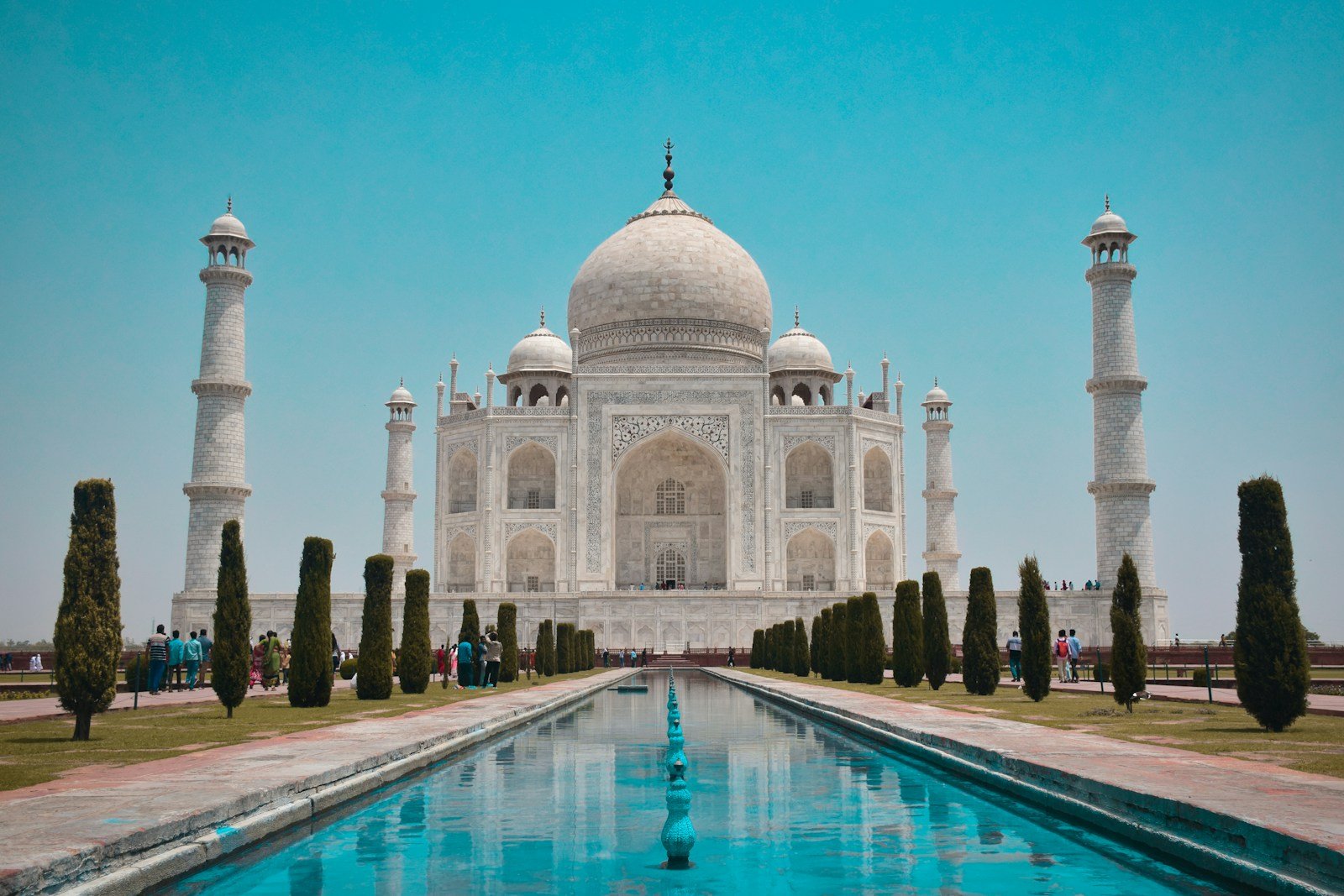 Majestic Taj Mahal reflecting pool in Agra India at sunrise
