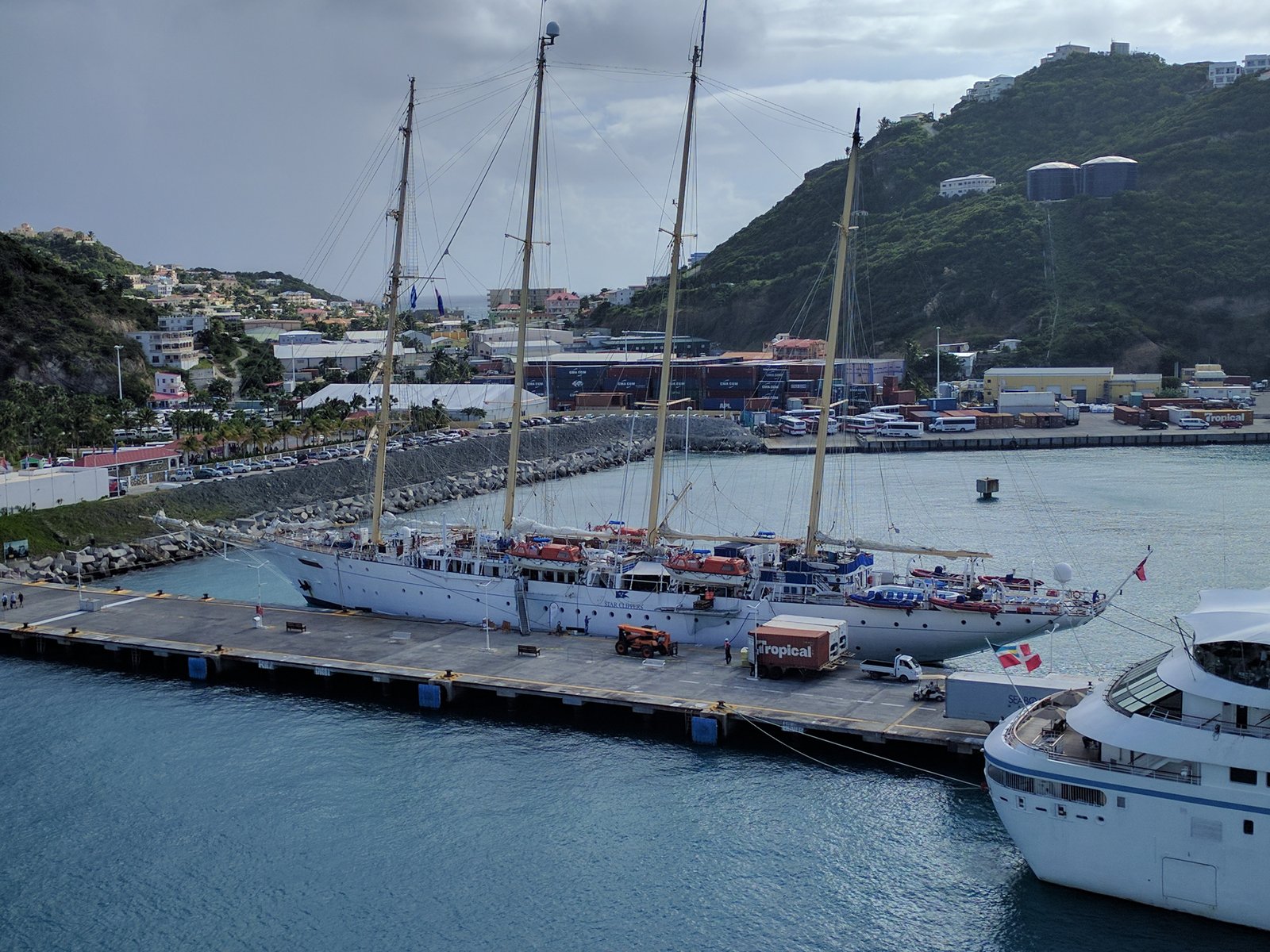 Wide view of Star Flyer's gleaming open teak sun deck with rigging and mast structures
