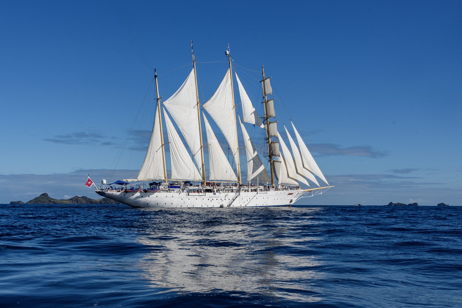 Full starboard profile of Star Flyer showing her clipper bow and gold-leaf trim