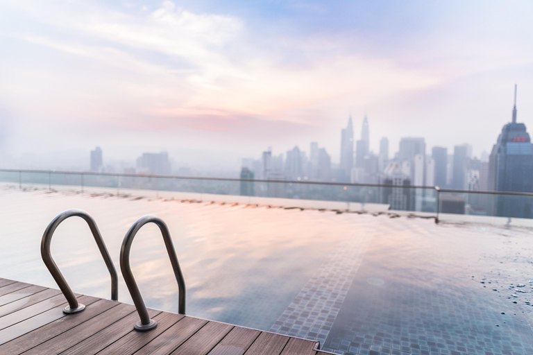 Oceanfront luxury resort infinity pool suite with Signature Travel Network VIP upgrades and resort credits