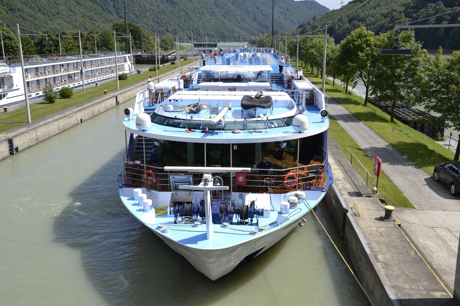 Tauck Inspiration Class river cruise ship showcasing Upper Diamond Deck suite French balcony windows