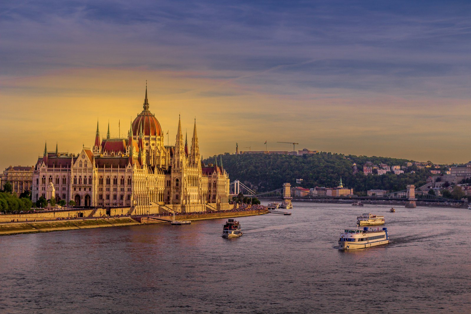 Tauck luxury riverboat docked along the Danube River near historic European landmarks