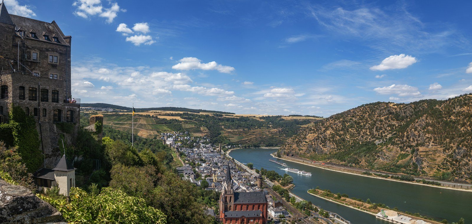 Picturesque European riverside castle seen from a Tauck river cruise ship on the Rhine River