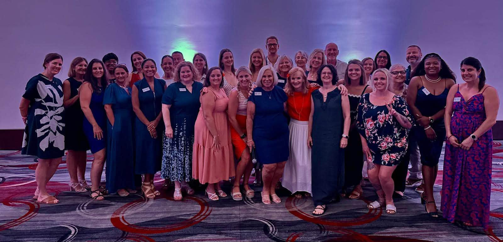 Official commemorative group photo of Vincent Vacations 2026 Annual Retreat attendees at Secrets Mirabel Cancun