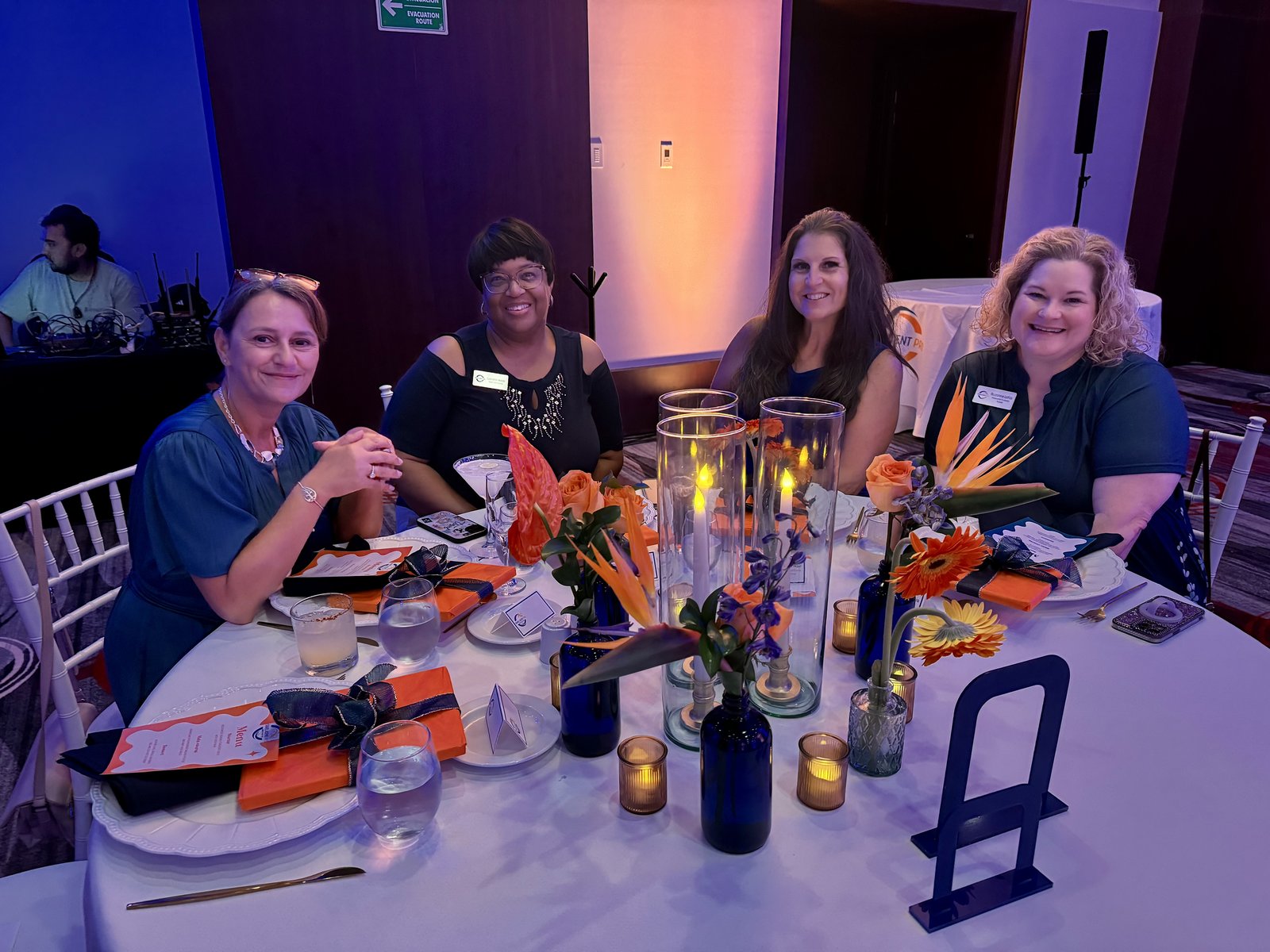 Travel Agent Pro advisors seated at an elegant dinner table during the farewell celebration at Secrets Mirabel