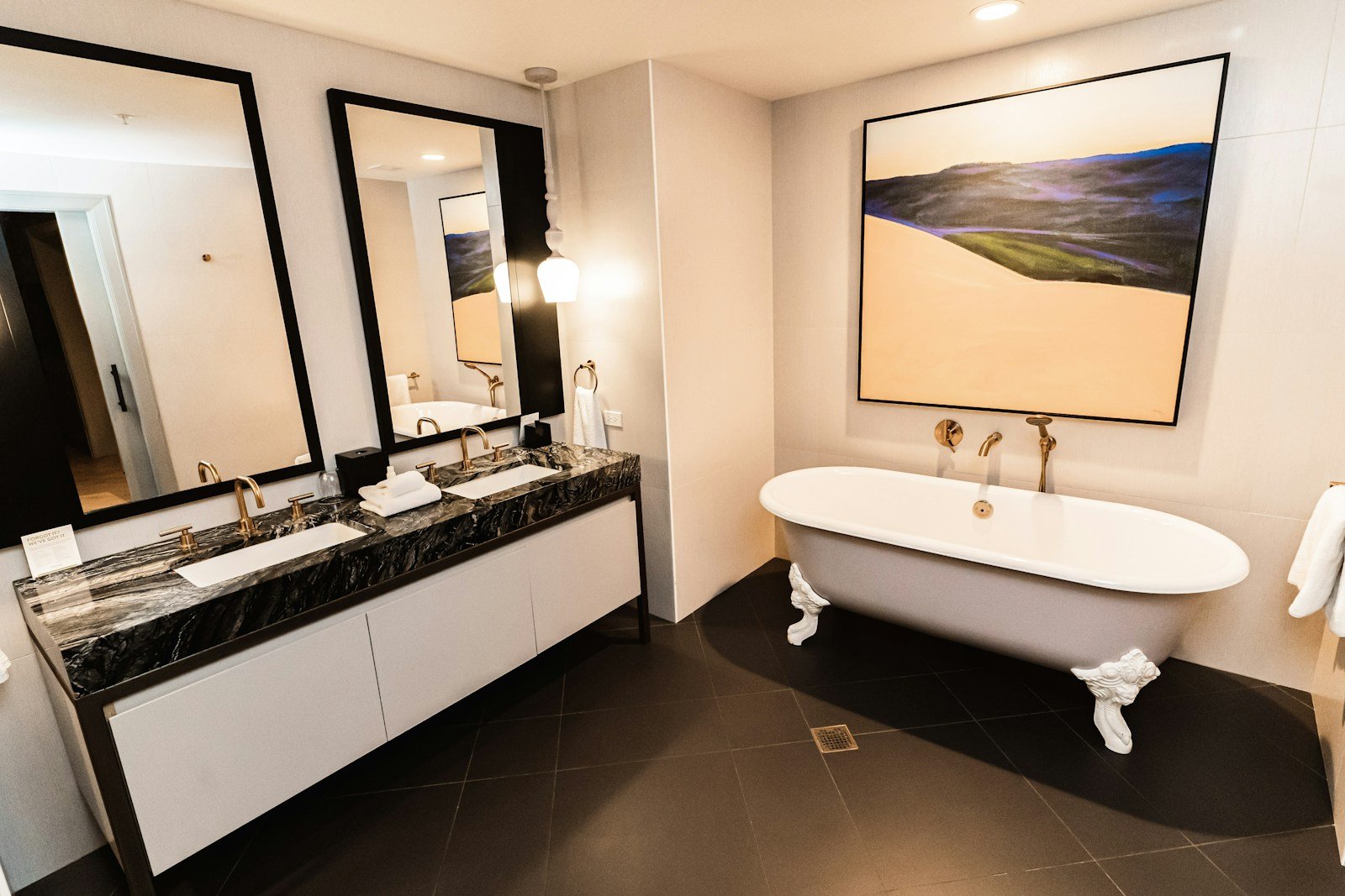 Opulent marble bathroom with deep soaking tub and polished chrome fixtures in a Uniworld Royal Suite
