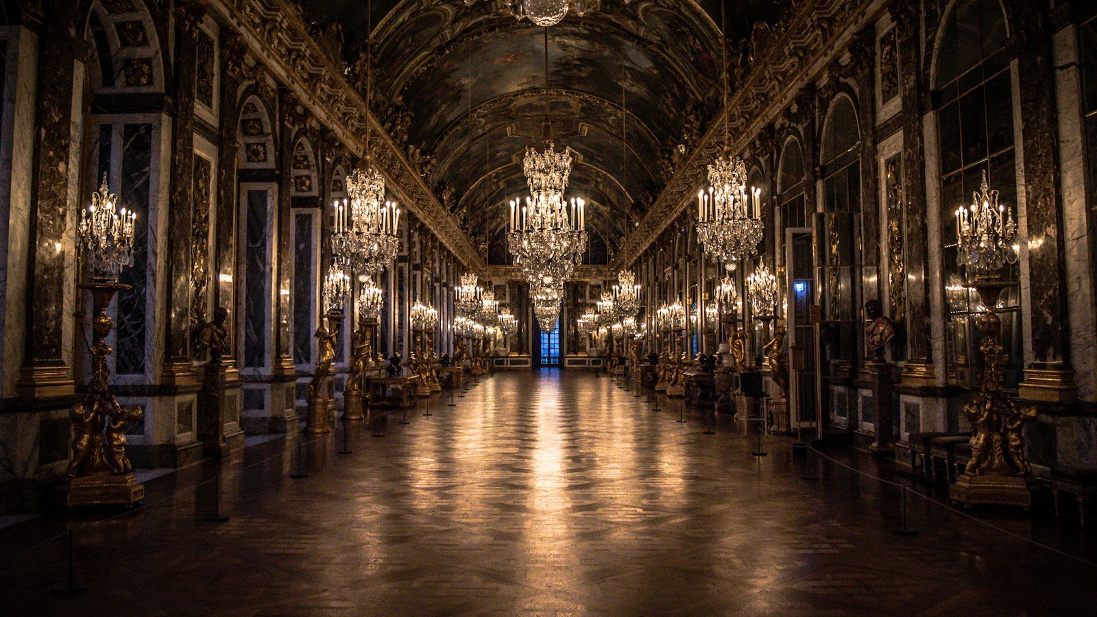 Grand gilded European hall with mirrors and chandeliers reflecting the opulent interior decor of Uniworld Super Ships