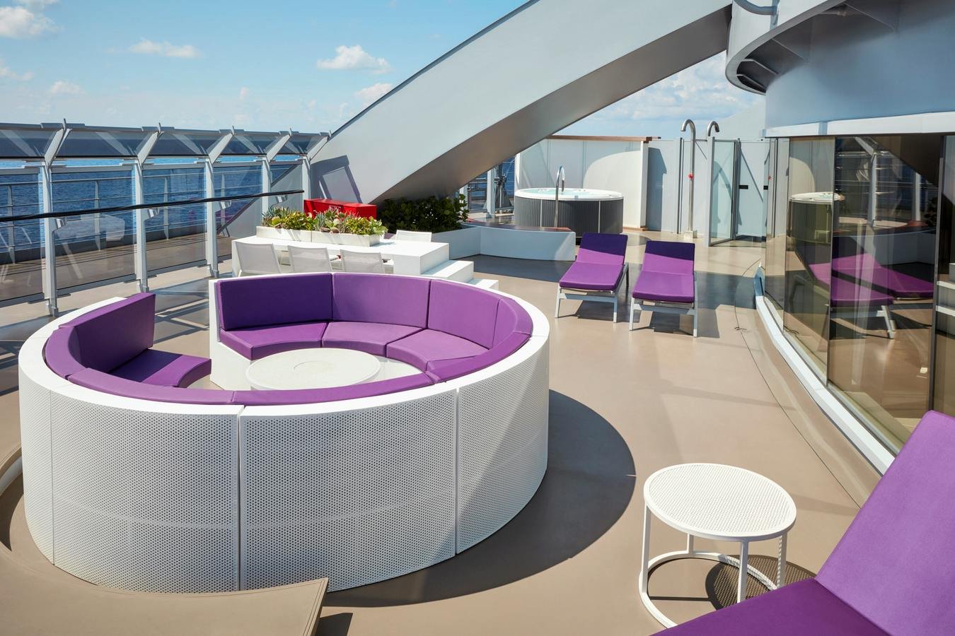 Official Virgin Voyages Massive Suite expansive runway terrace with circular conversation booth and sun loungers